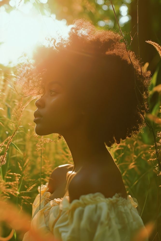 A stylist mixed race american-african woman contemplation backlighting tranquility.