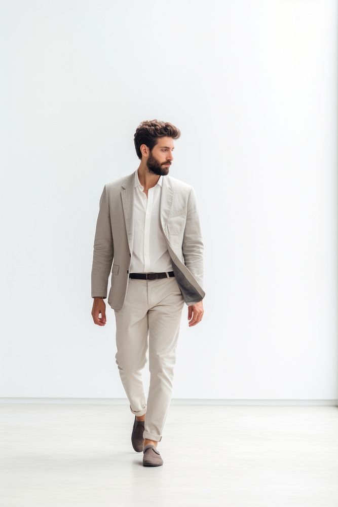 A man walking in studio standing blazer adult.