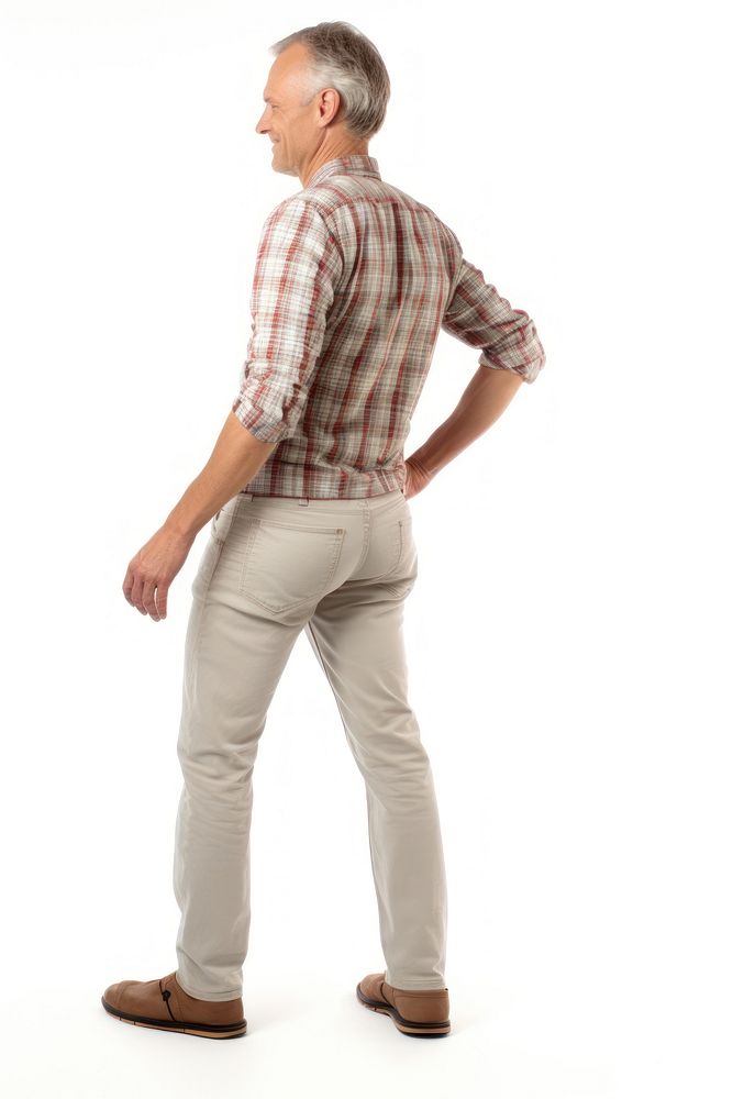 A man getting lower back pain standing walking shirt.