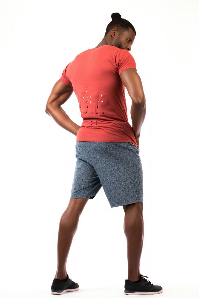 A man getting lower back pain t-shirt shorts white background.
