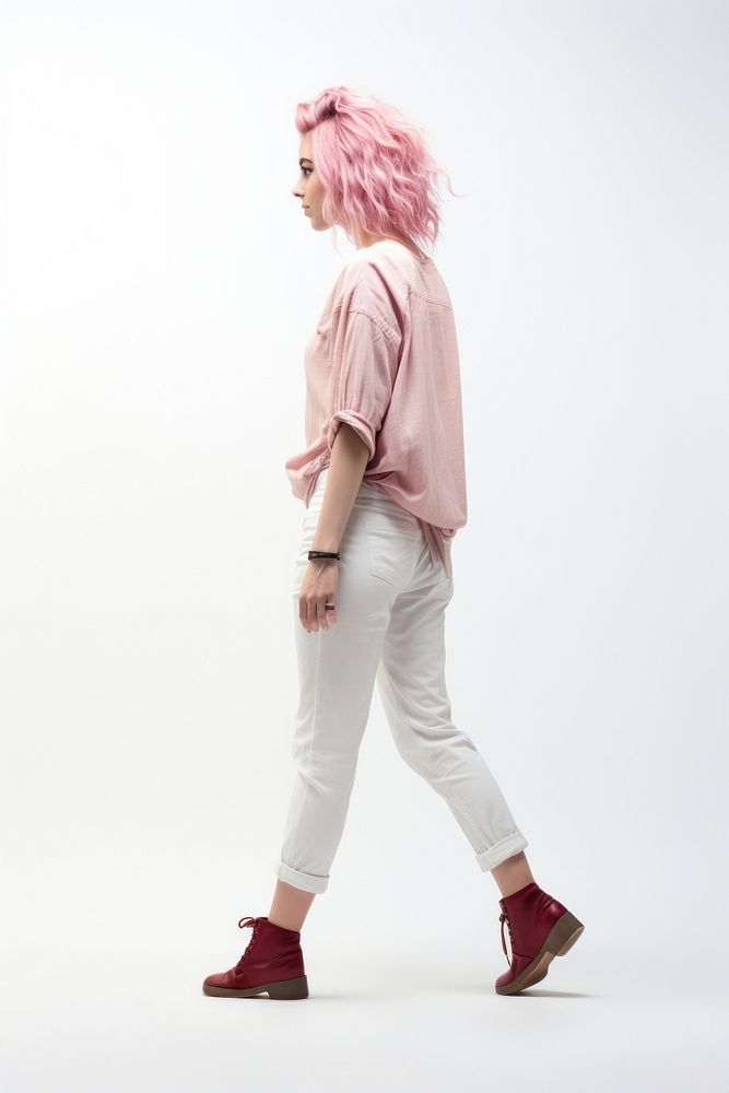 A teenager girl walking in studio individuality hairstyle footwear.