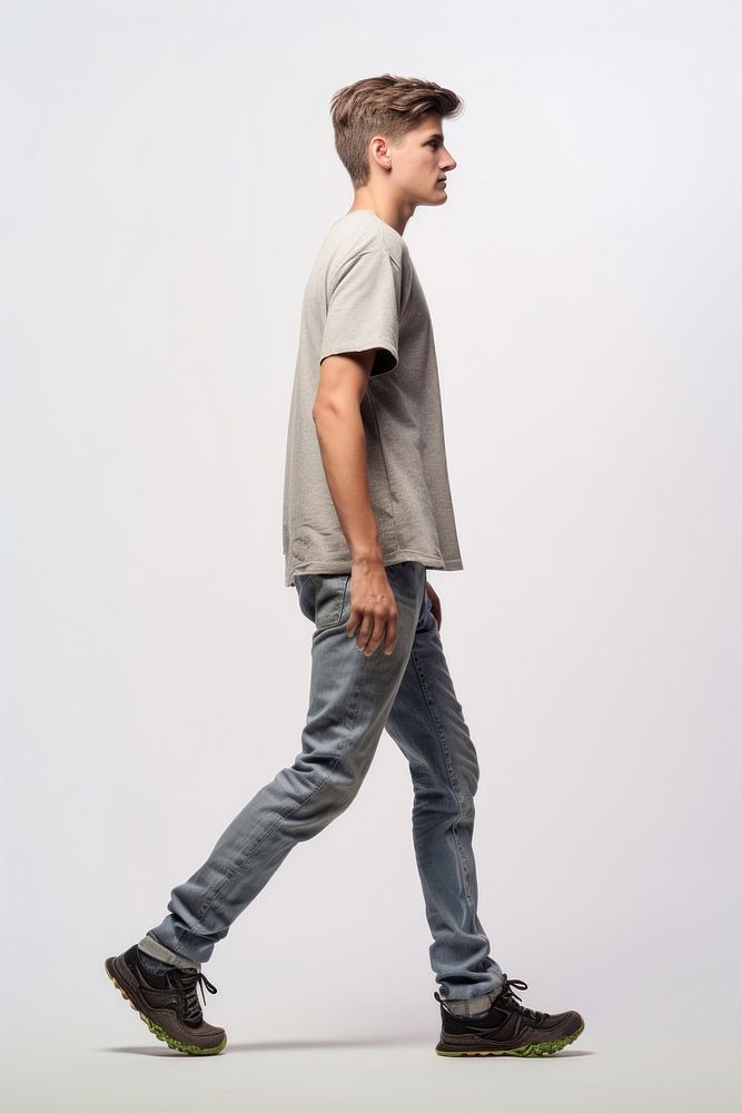 A teenager man walking in studio footwear standing t-shirt.