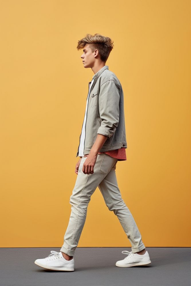 A teenager man walking in studio footwear standing shoe.