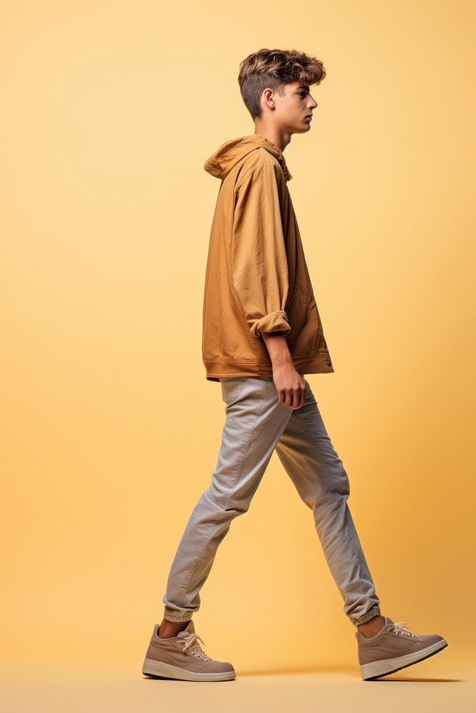 A teenager man walking in studio footwear fashion shoe.