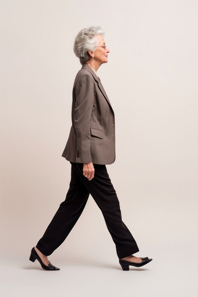 A senior woman walking in studio footwear portrait adult.