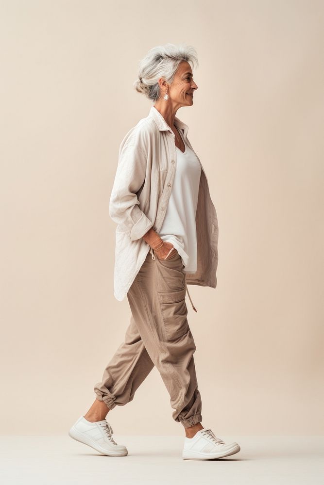 A senior woman walking in studio footwear adult retirement.