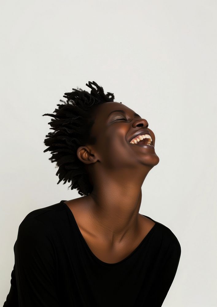 A side view of a laughing black woman happiness smile adult.