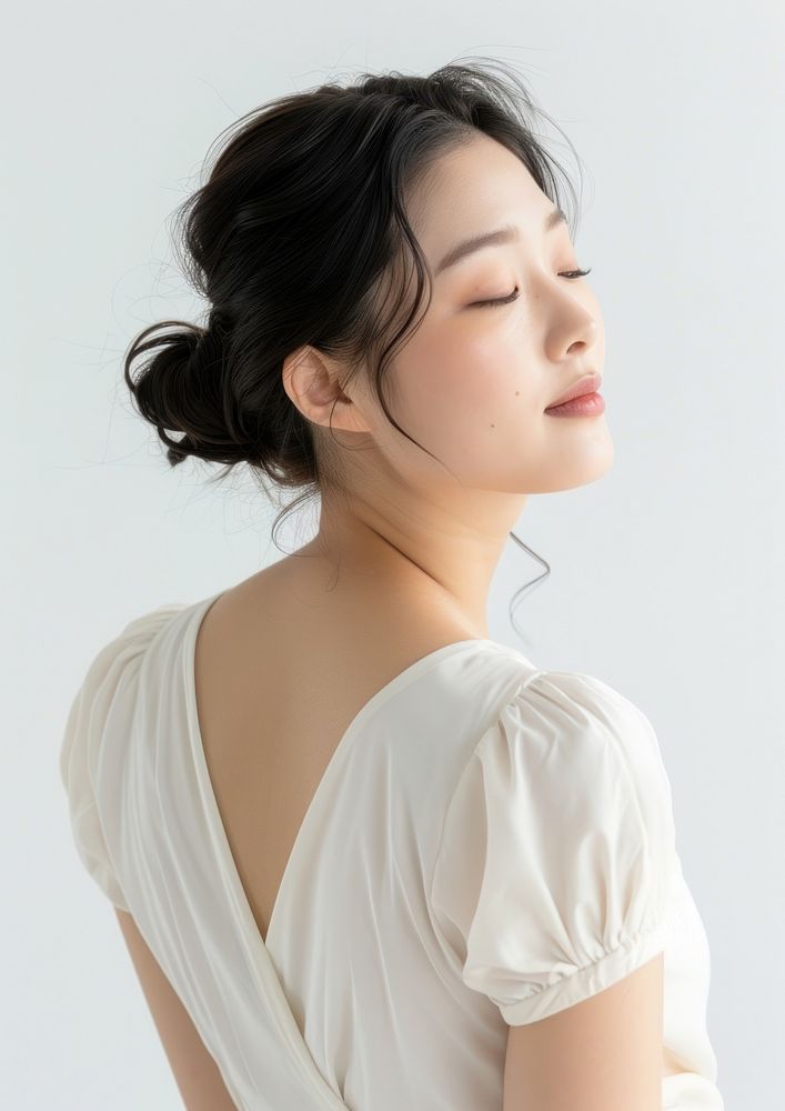 An Asian woman showcasing her back portrait adult white.