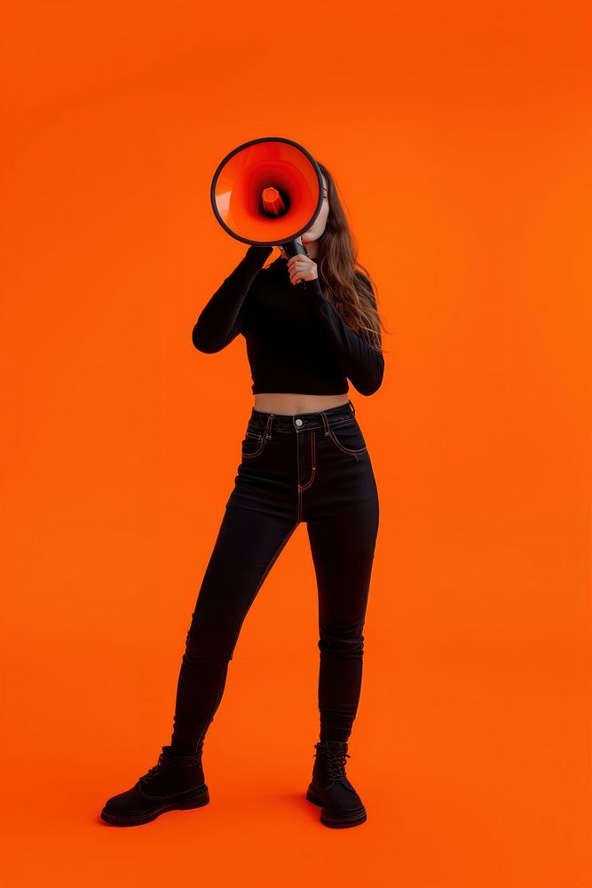 Woman holding megaphone adult photo orange background.