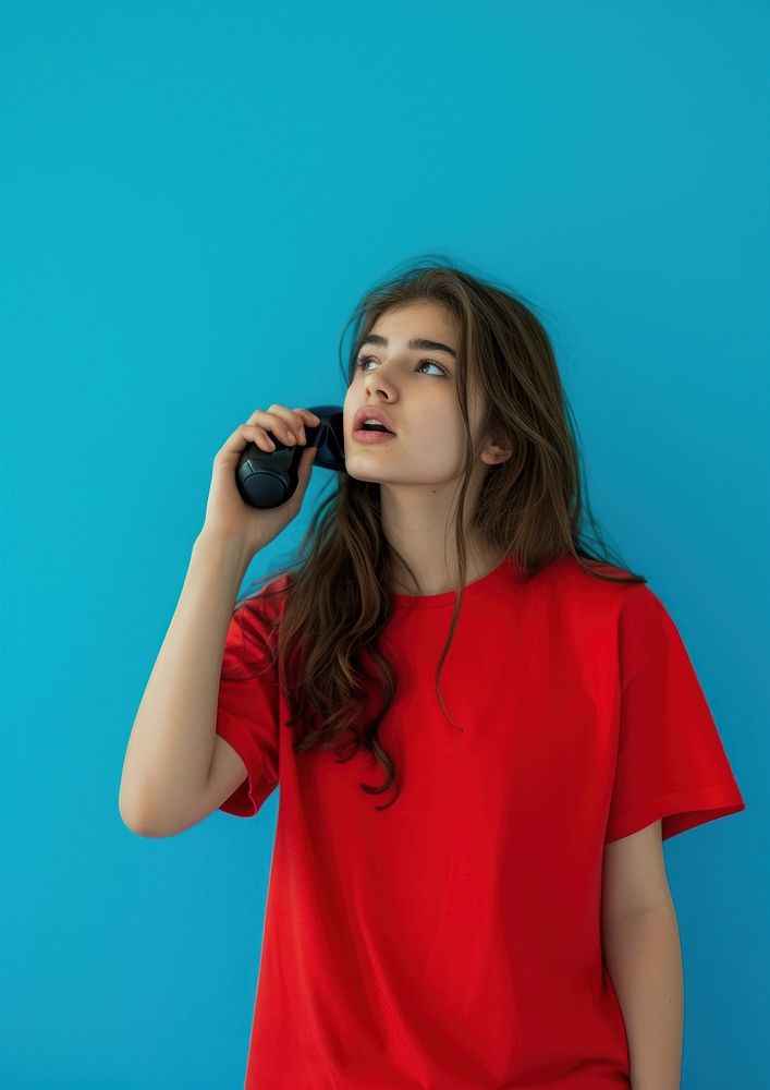 Woman calling with telephone sleeve photo blue.