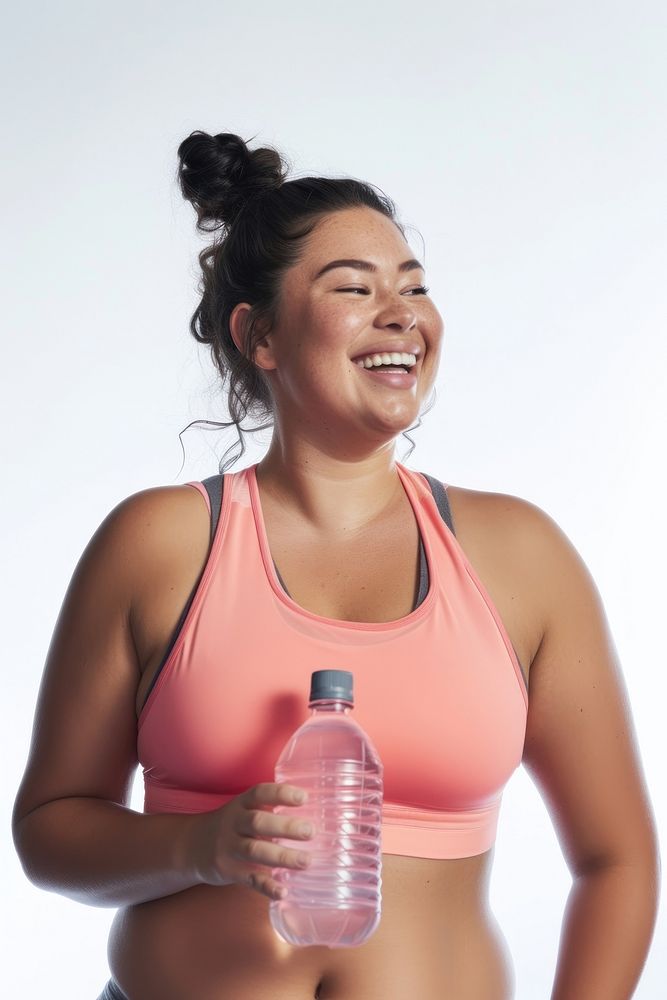 A chubby woman holding water bottle and smiling and looking up while exercising swimwear adult white background.