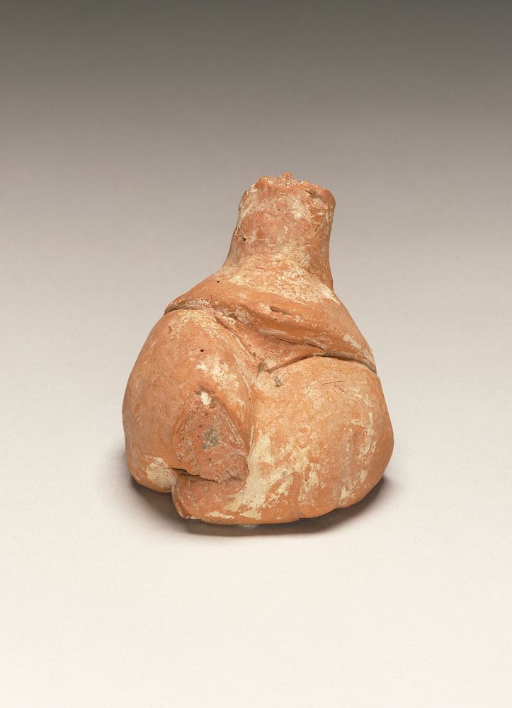 Fragmentary Neolithic seated female figurine