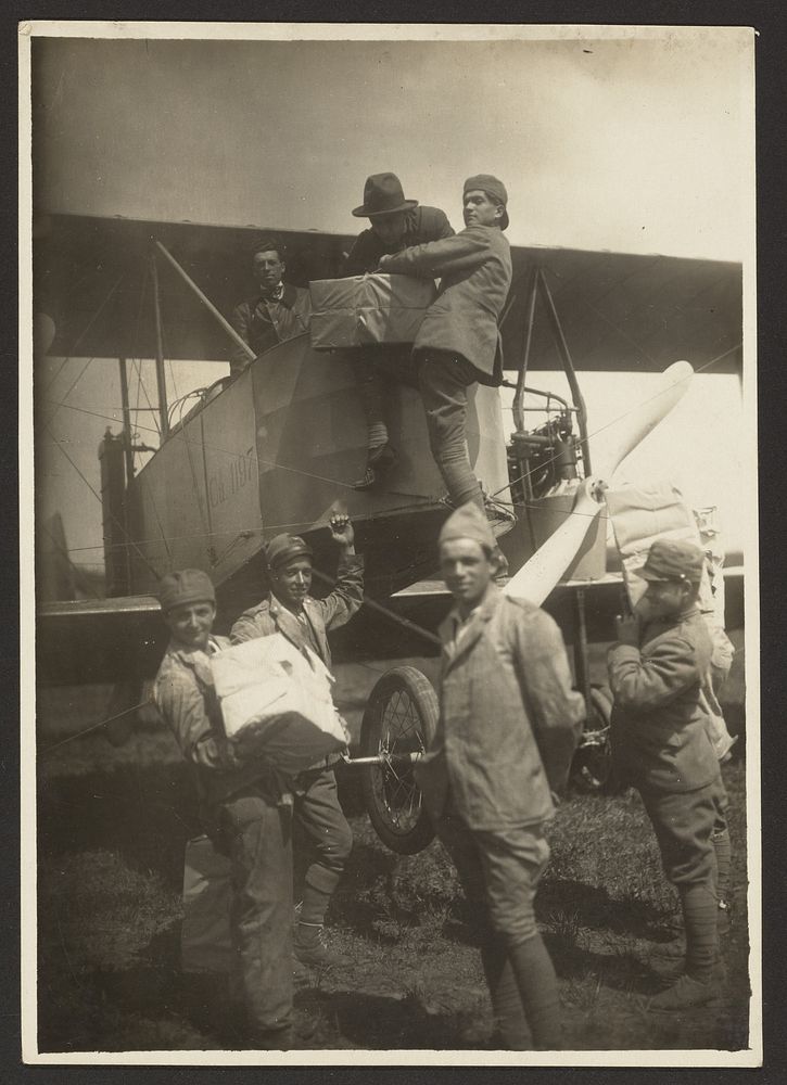 Soldiers loading supplies in plane by Fédèle Azari