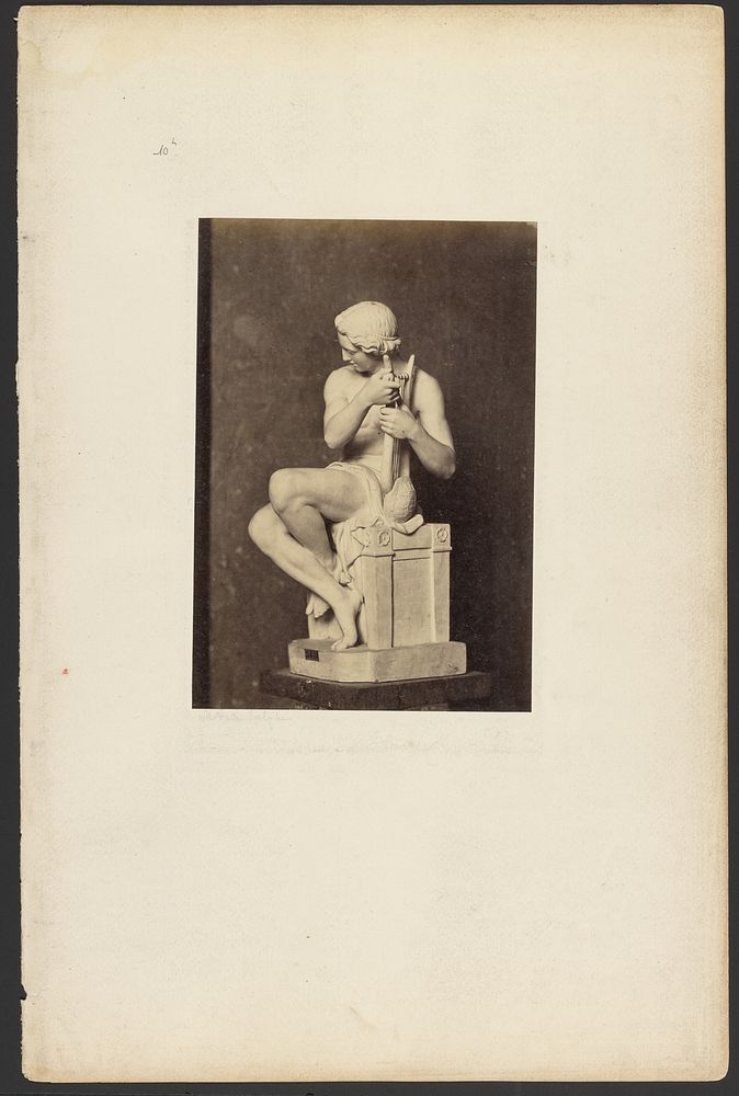 Sculpture of boy playing lyre