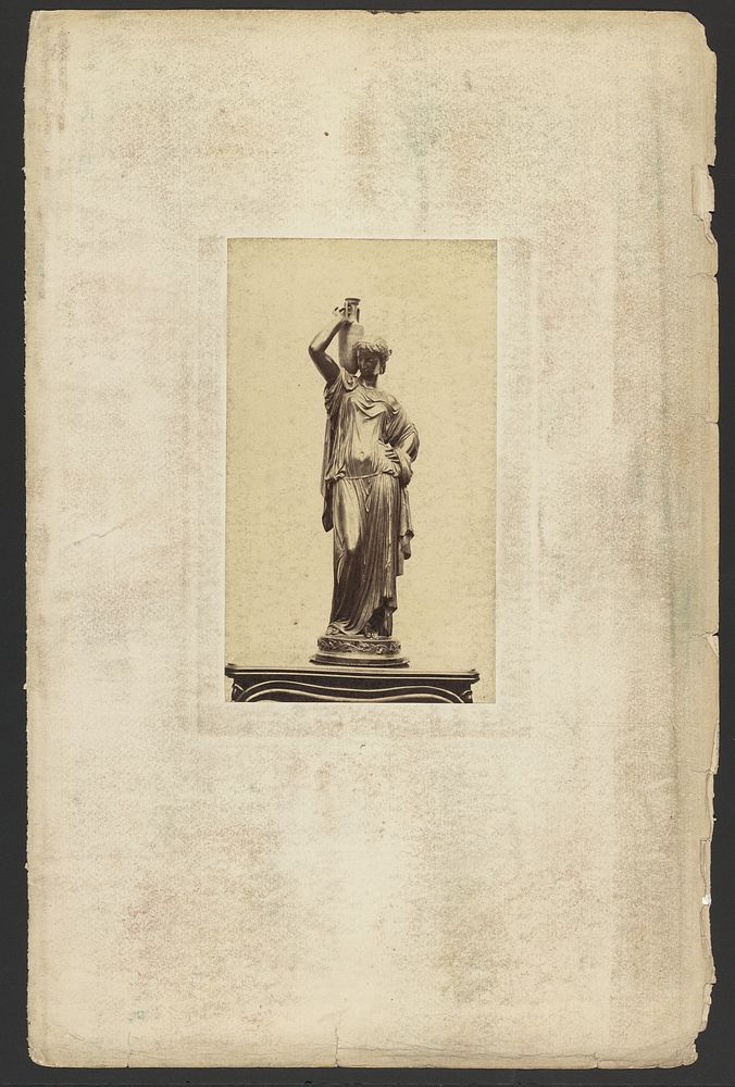Sculpture of woman holding urn