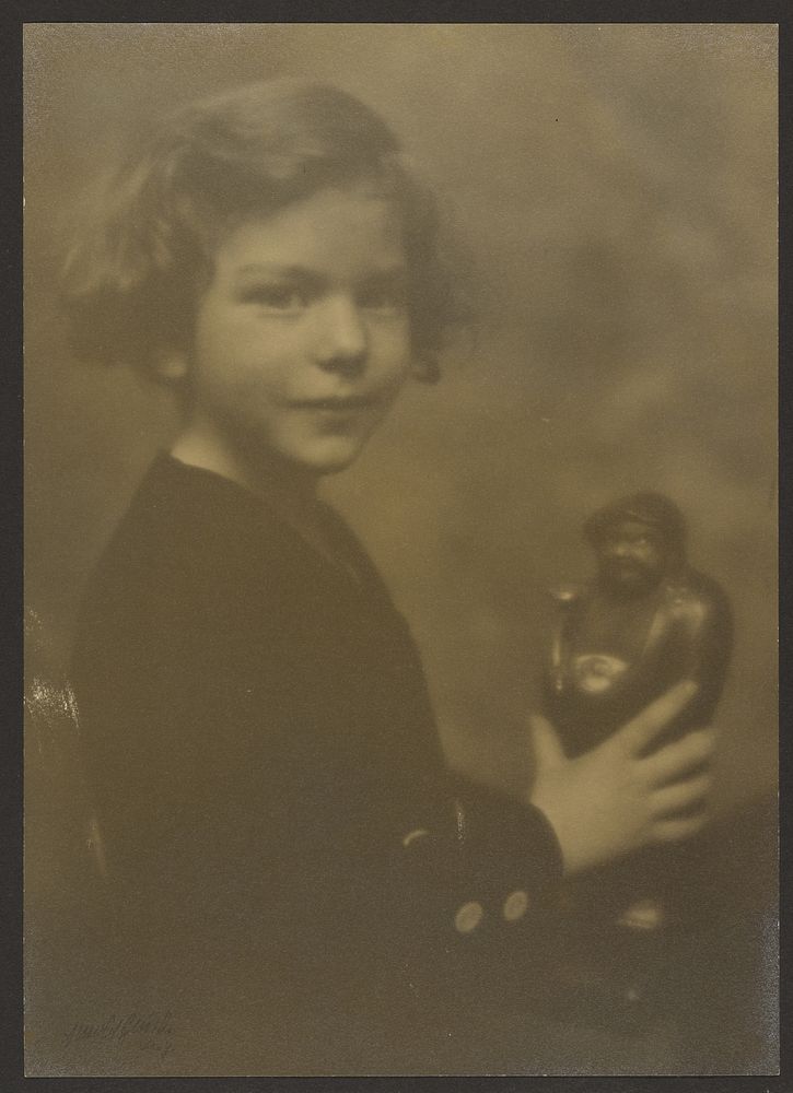 Young Girl with figurine by Arnold Genthe