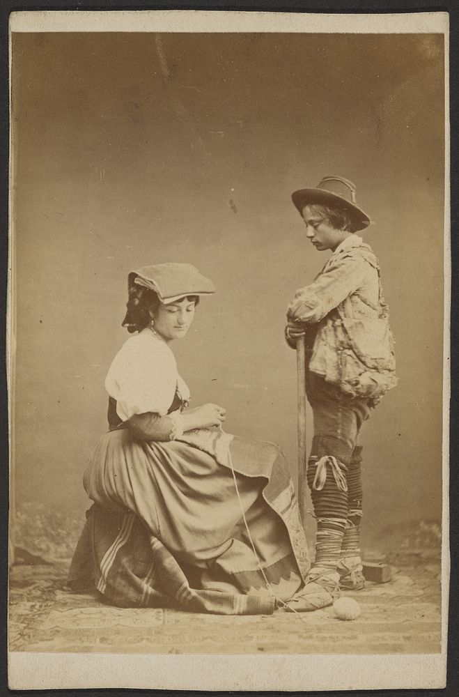 Woman sewing while boy watches