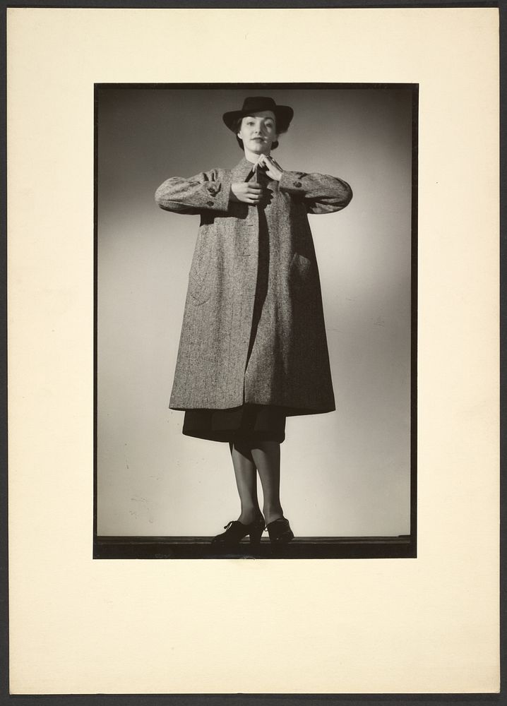 Woman modeling a coat by Günther Krampf