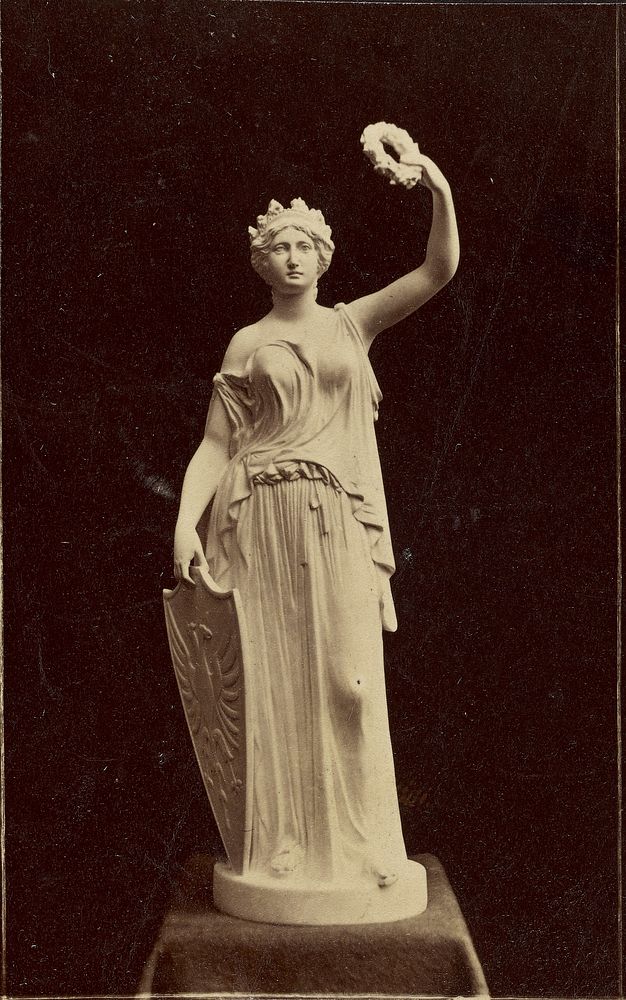 Statue of figure with crown