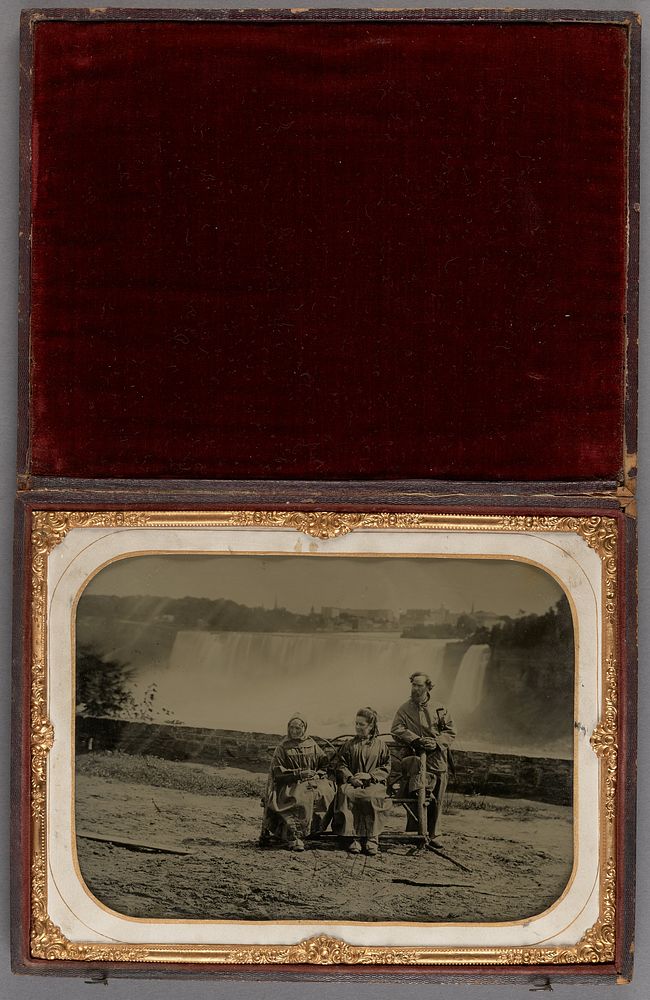 Portrait of Three people posed on a bench at Niagara Falls by Saul Davis