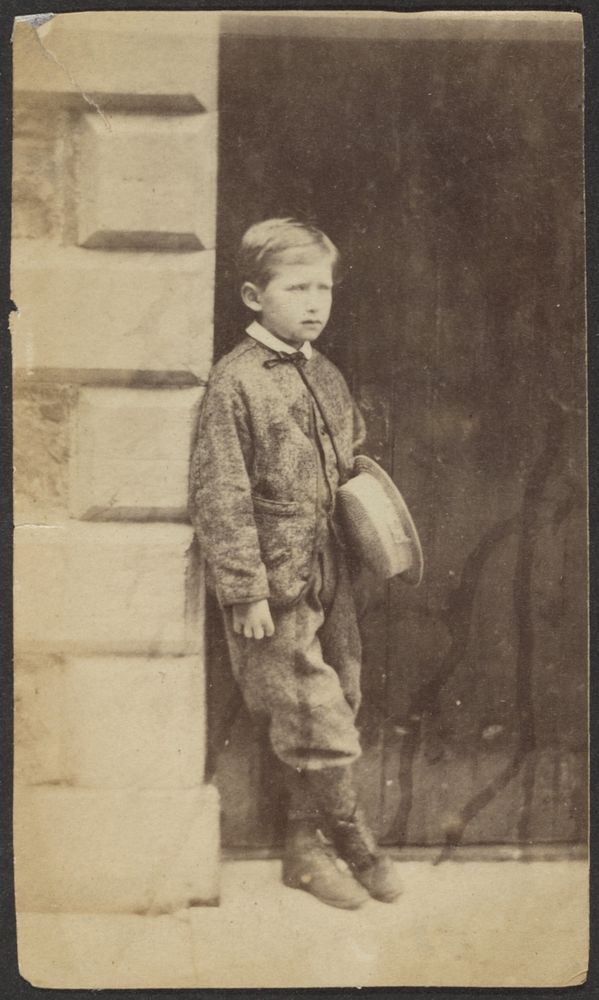 Portrait of a Young Boy in a Doorway