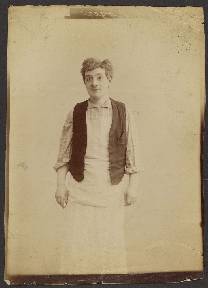 Man wearing a vest and apron