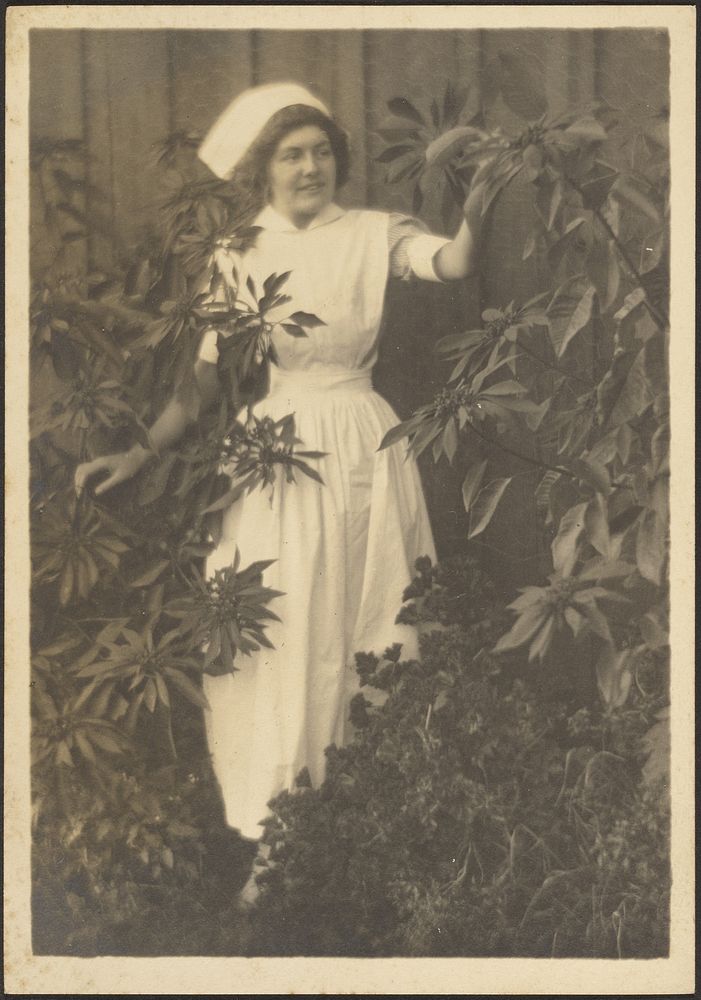 Woman Dressed as Nurse in Garden by Louis Fleckenstein