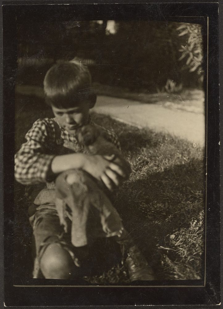 Boy Holding Small Animal by Louis Fleckenstein