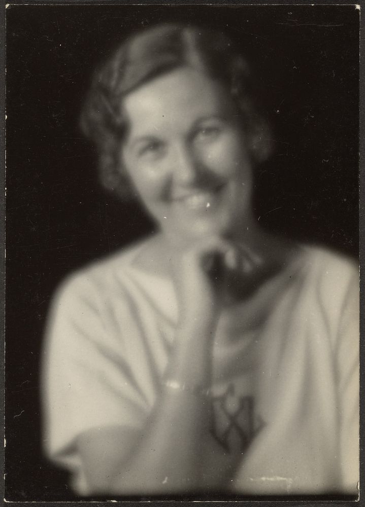 Woman Smiling with Hand on Chin by Louis Fleckenstein