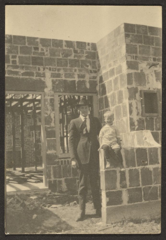 Man with Standing with Child in House Under Construction by Louis Fleckenstein