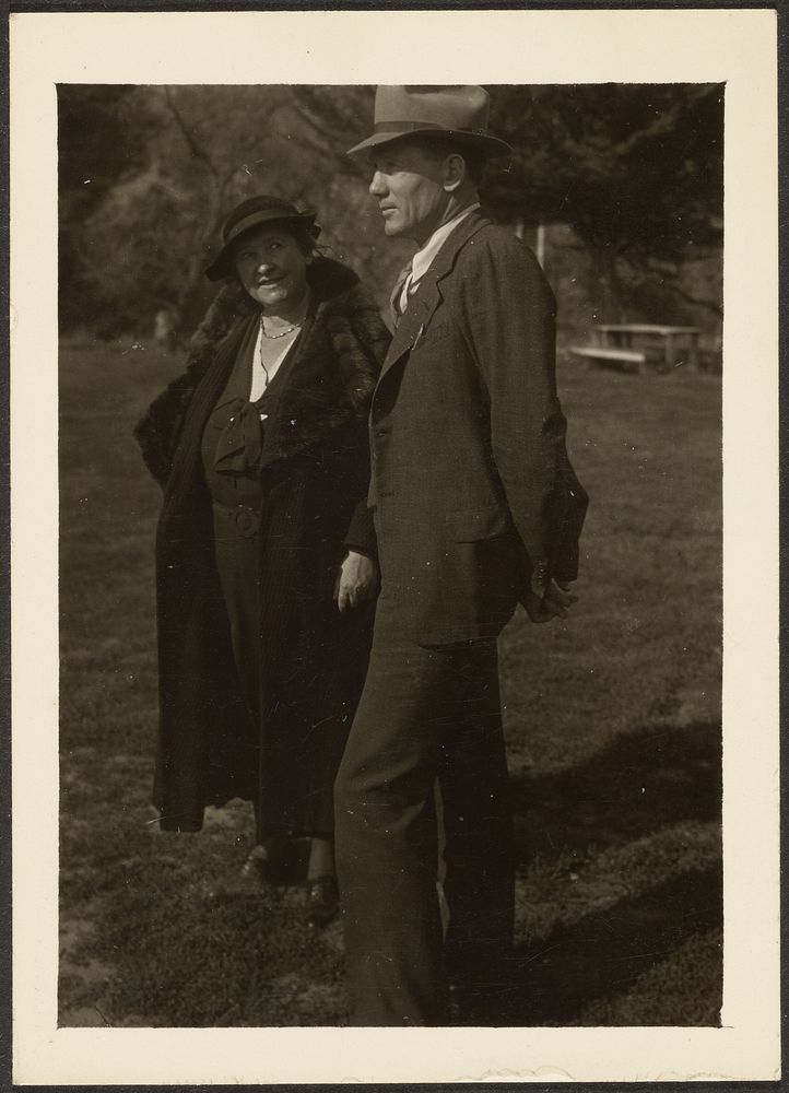 Man and Woman Standing in Grass by Louis Fleckenstein