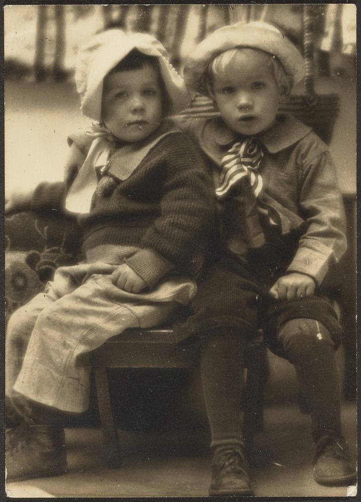 Two Children Sharing Chair by Louis Fleckenstein