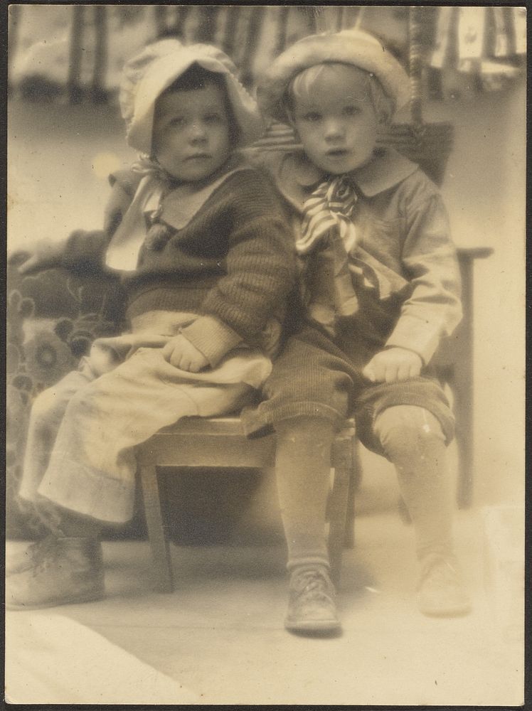 Two Children Sharing Chair by Louis Fleckenstein
