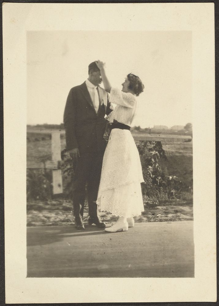 Man and Woman Dressed Up on Roadside by Louis Fleckenstein