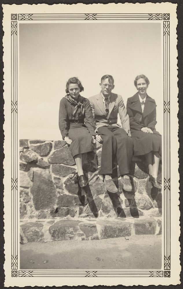 Three People Seated on Stone Wall by Louis Fleckenstein