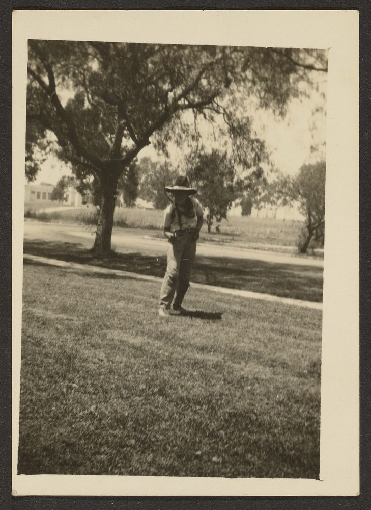 Boy in Cowboy Hat in Yard by Louis Fleckenstein
