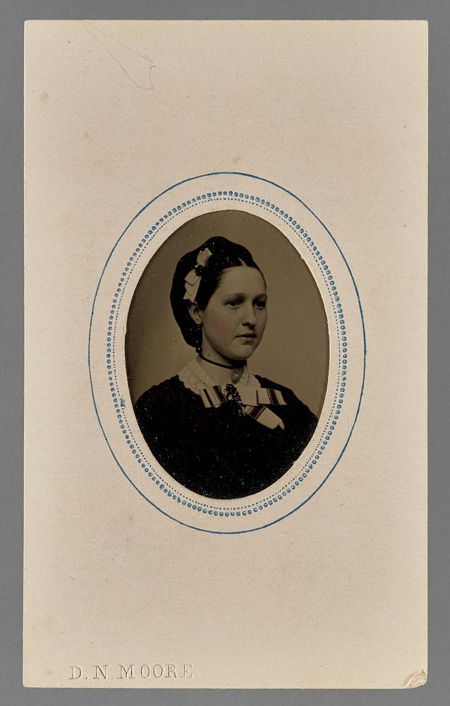 Portrait of a young woman with a bow in her hair by D N Moore