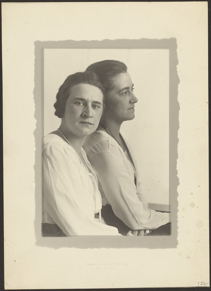 Portrait of Two Women Against White Backdrop by Louis Fleckenstein