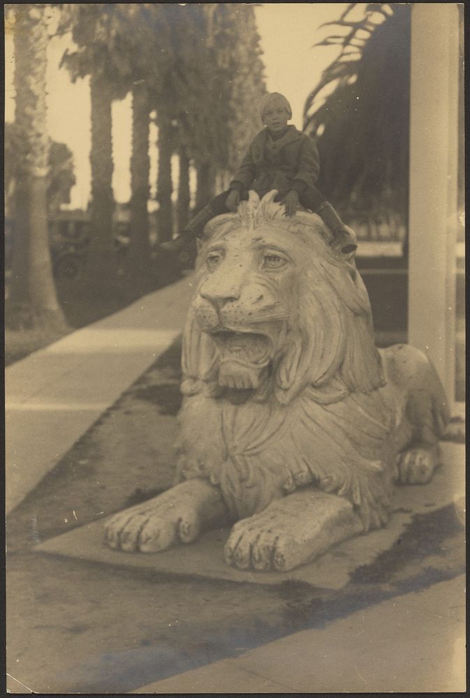 Child on Lion Statue by Louis Fleckenstein