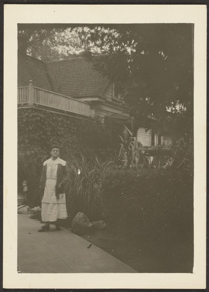 Woman Outside House by Louis Fleckenstein