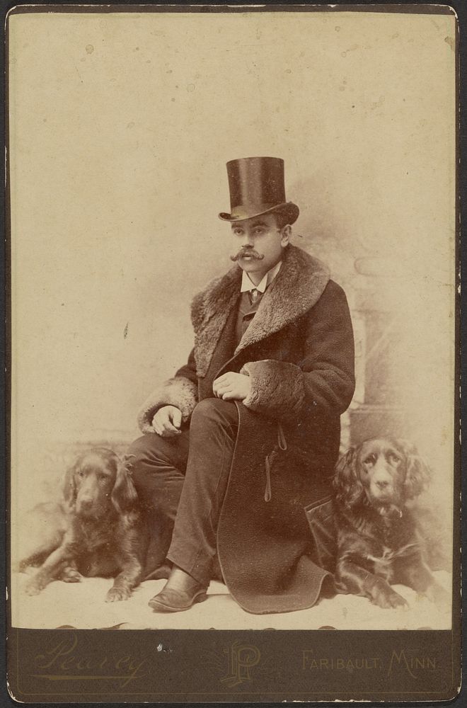 Portrait of a Moustachioed Seated Man in Top Hat and Winter, Fur-Collared Coat with a Cocker Spaniel Dog Resting at Both…