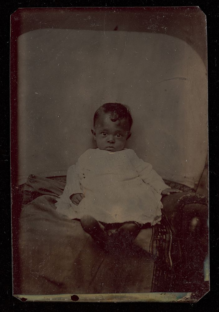 Portrait of a Seated Black child
