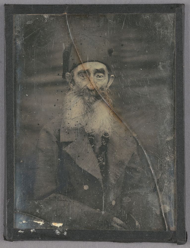Elderly French peasant man with white beard and native cap