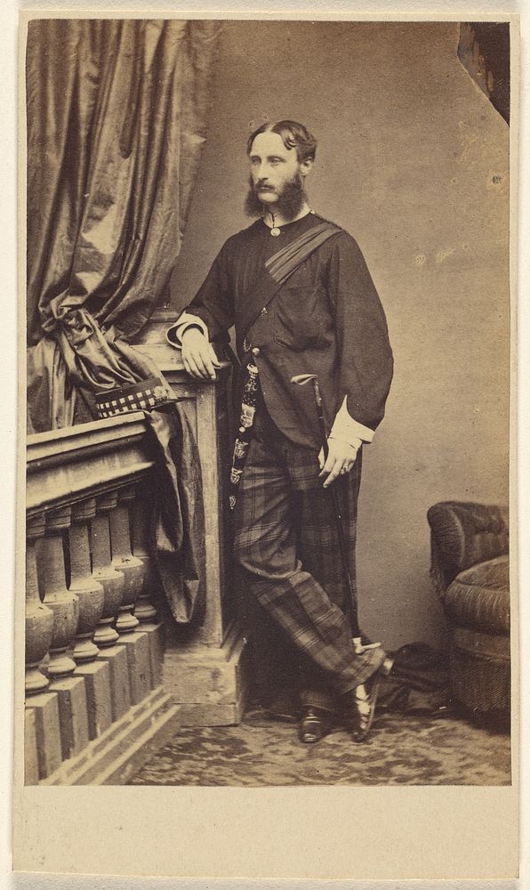 Unidentified man with moustache and  muttonchops, standing