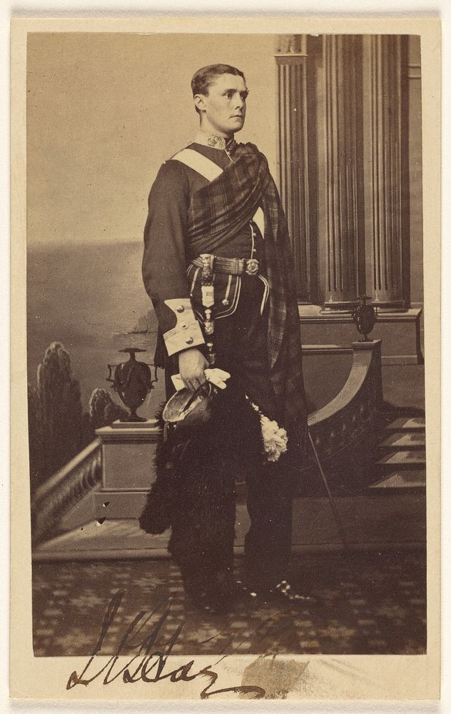 Unidentified man with sash, standing by F W Baker