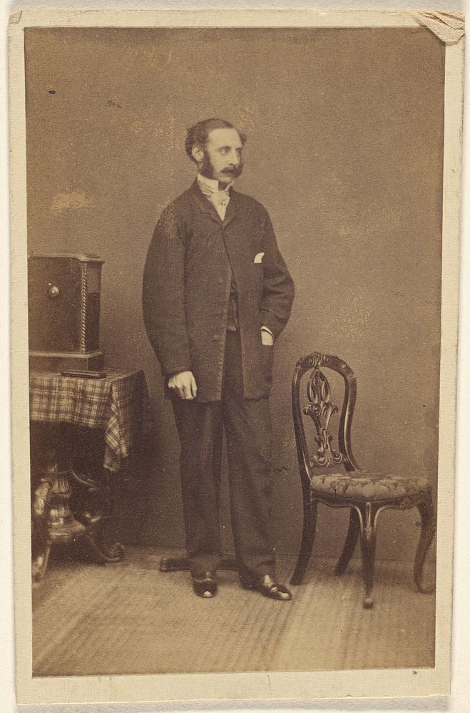 Unidentified man with moustache & muttonchops, standing