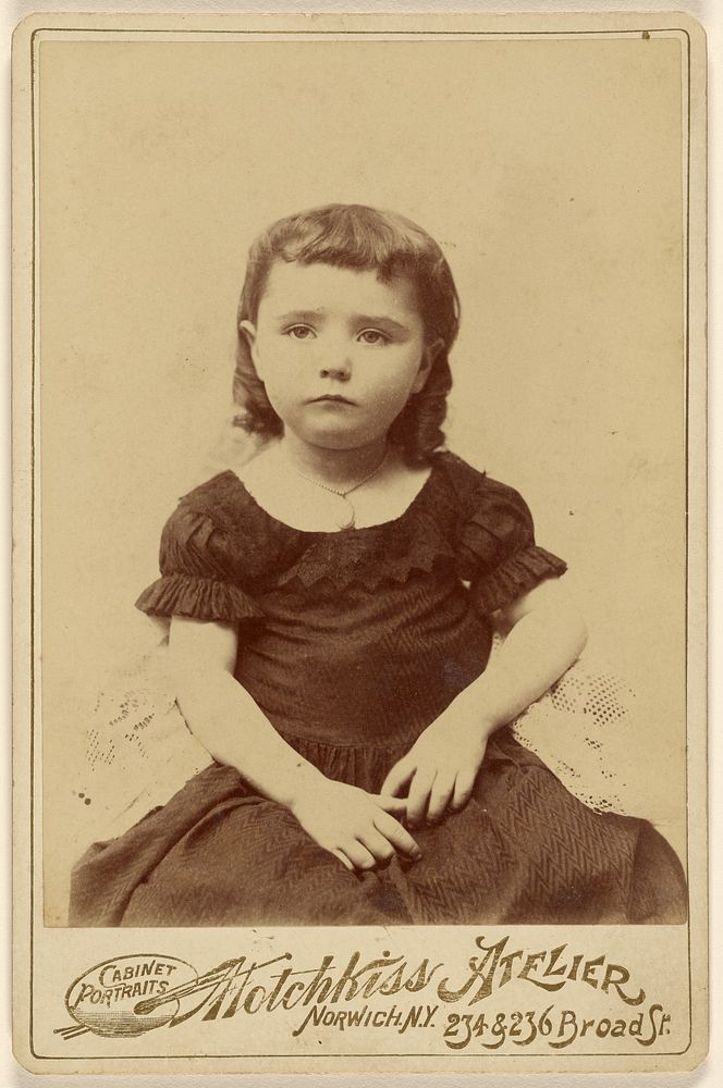 Little girl, seated by Hotchkiss