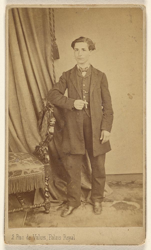 Unidentified man, standing by L Laporte