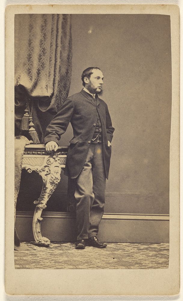 Unidentified man with long muttonchops, standing by Kitchen