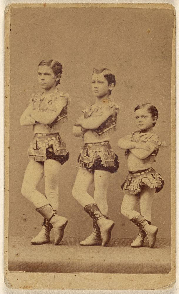 Three young male dancers or circus performers